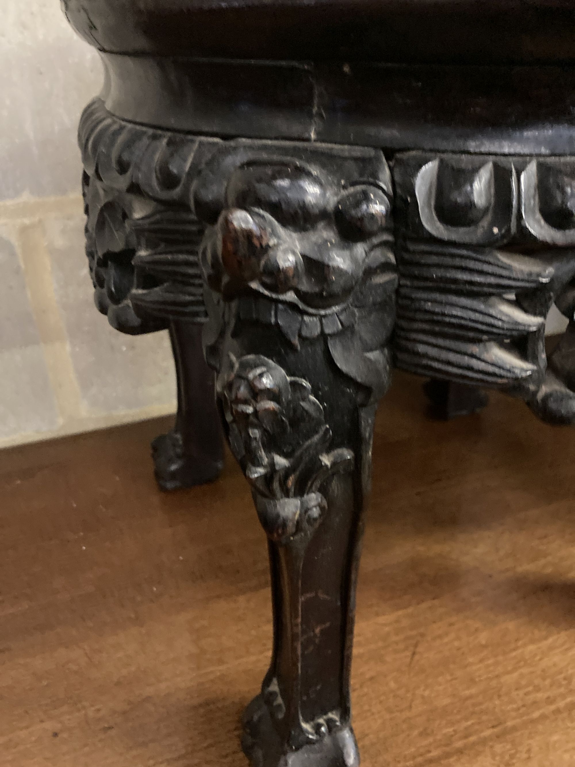 A pair of circular Chinese carved hardwood jardiniere stands, with rouge marble inset tops, 38cm diameter, height 38cm